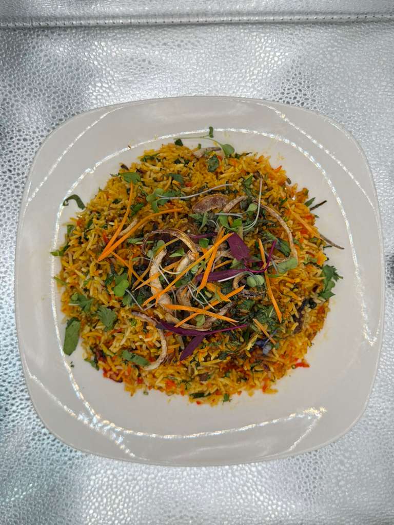 Fragrant Biryani with saffron rice and garnish