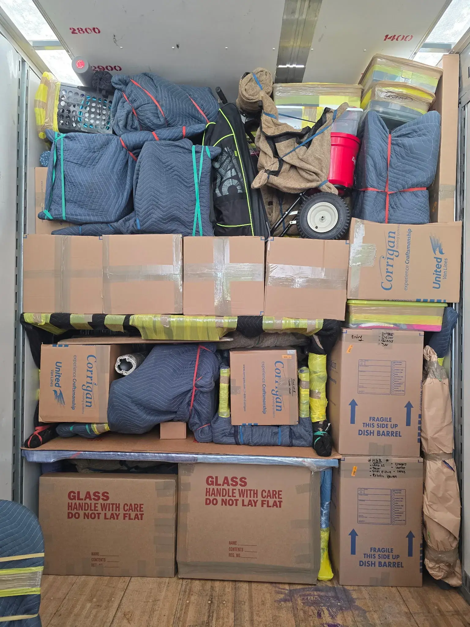 Carefully wrapped furniture and boxes loaded in truck