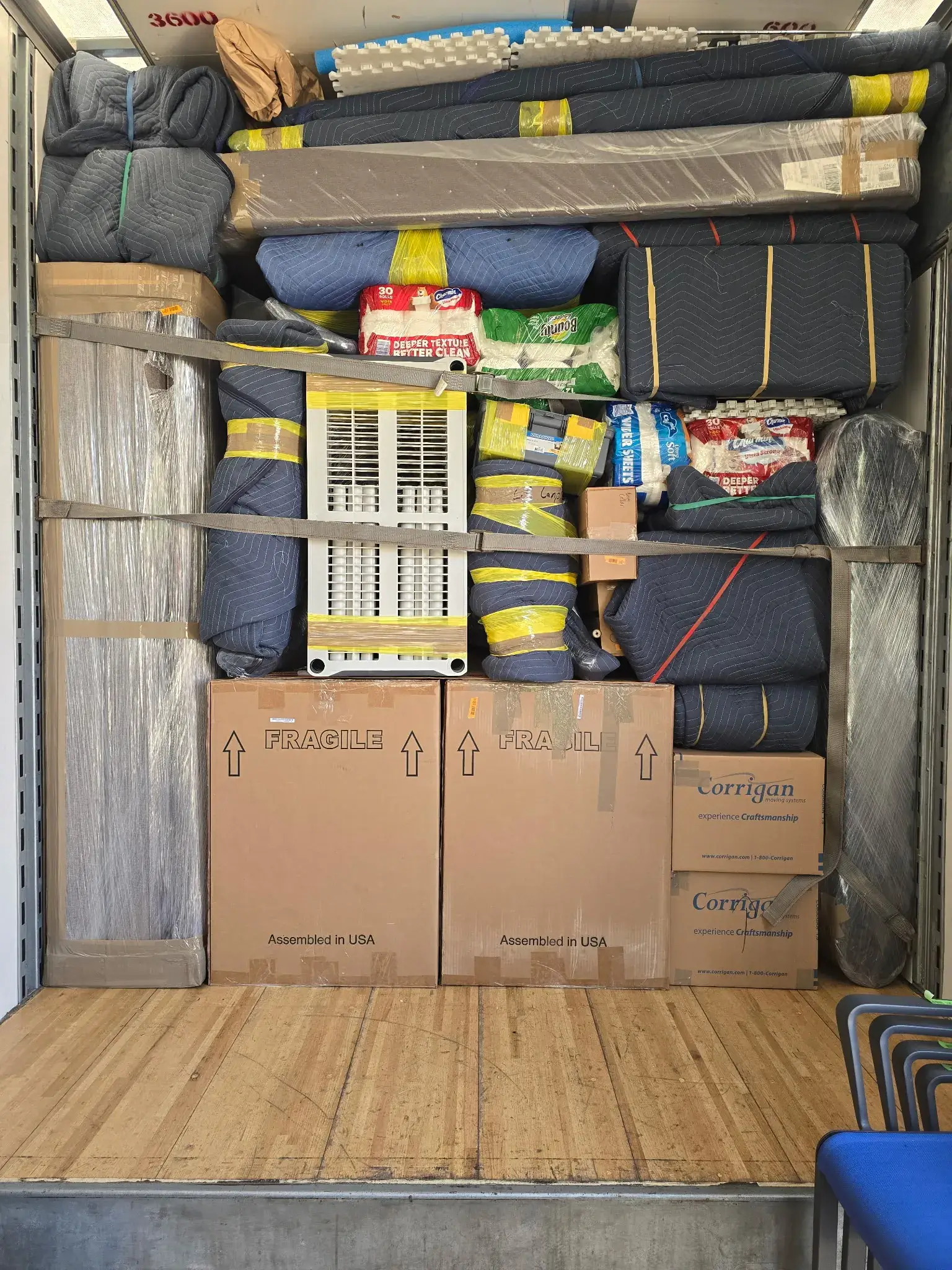 Professional movers securing items