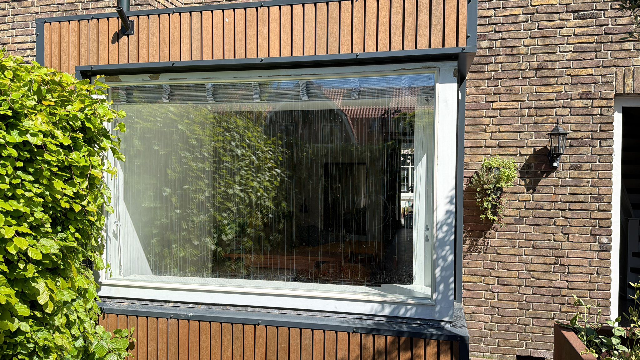 Glaszetter en klusbedrijf aan het werk in Baarn