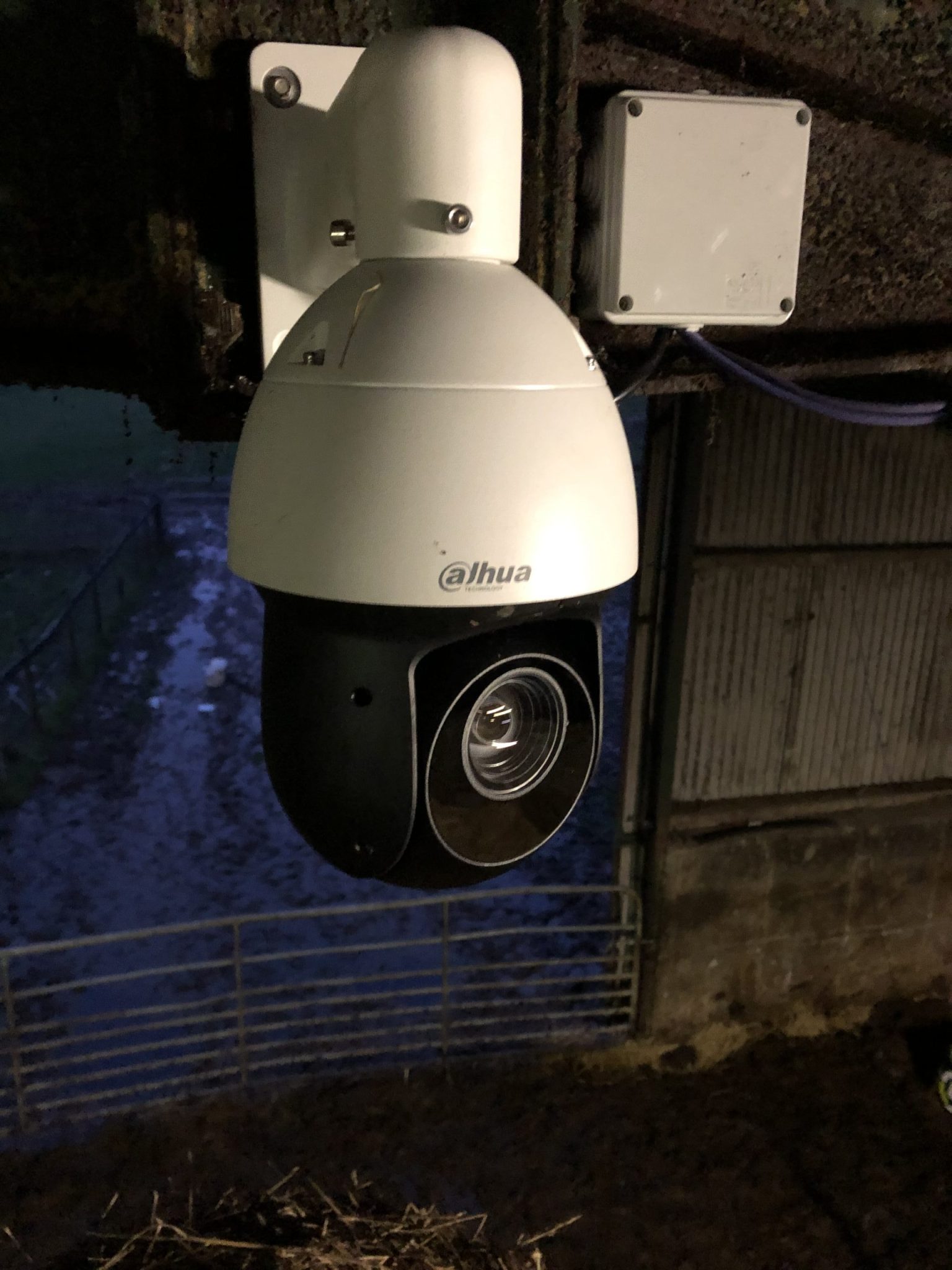 Dahua PTZ calving camera installed on agricultural shed wall at night
