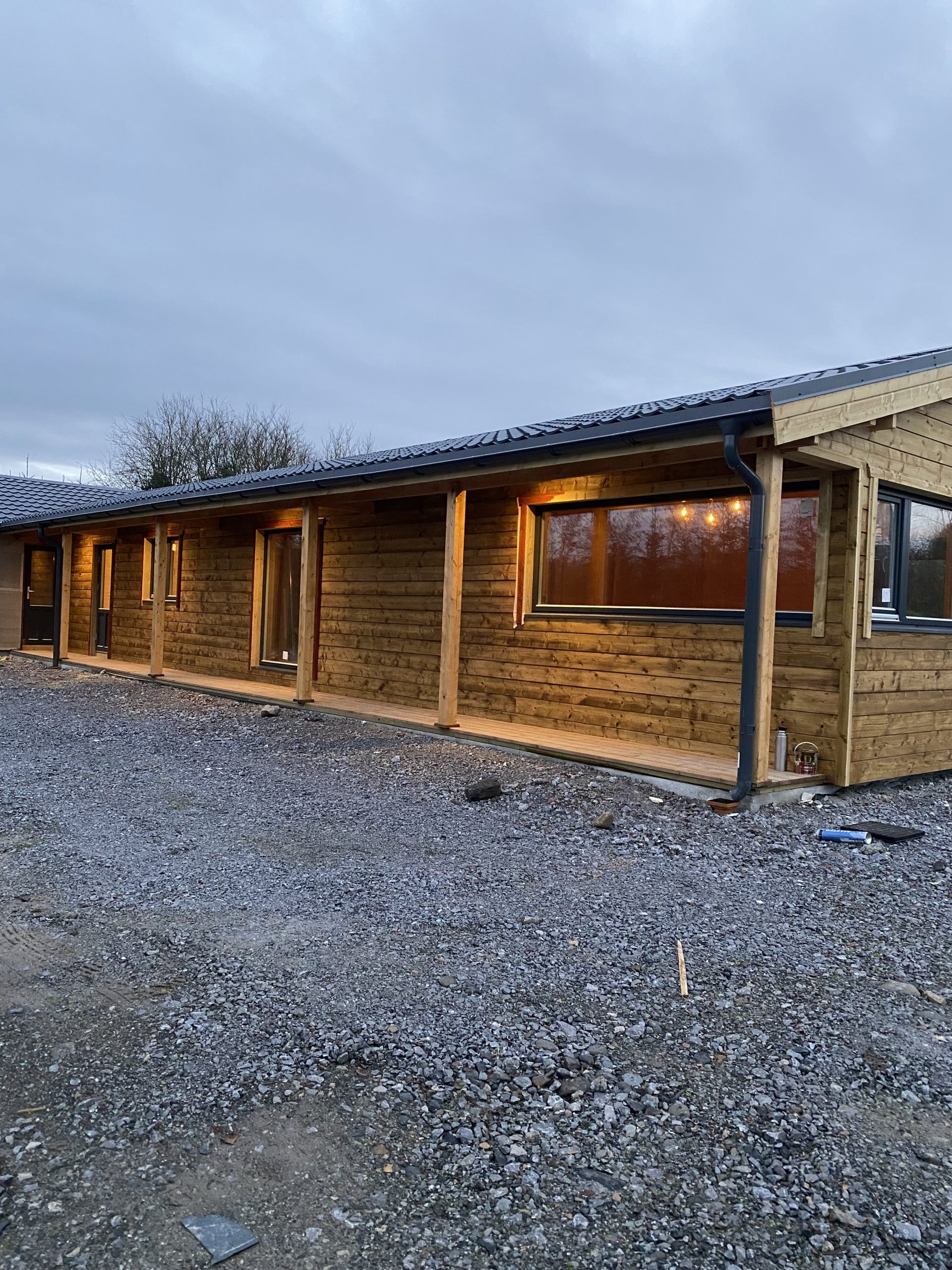 New timber-frame commercial building under construction with electrical fit-out underway