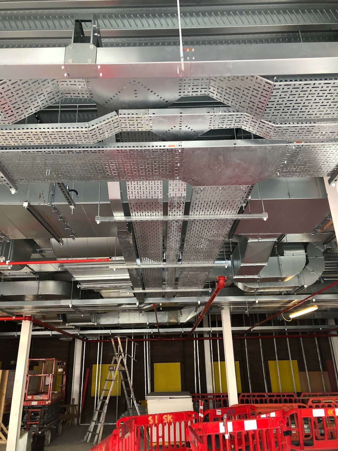 Commercial electrical containment tray and conduit installation in a commercial ceiling