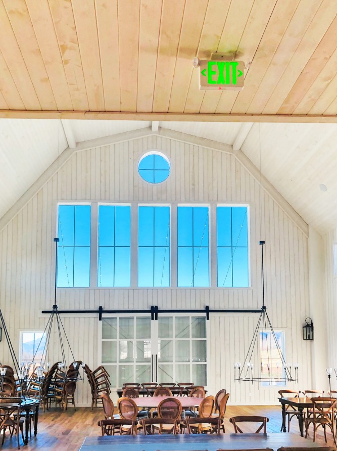 Large barn-style building with custom wood ceiling and trim