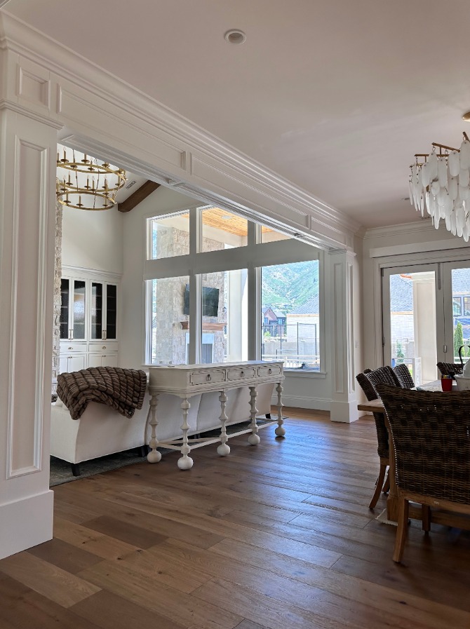 Living room with custom trim and large windows