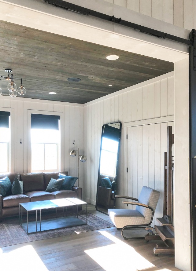 Living room with custom wood ceiling and trim