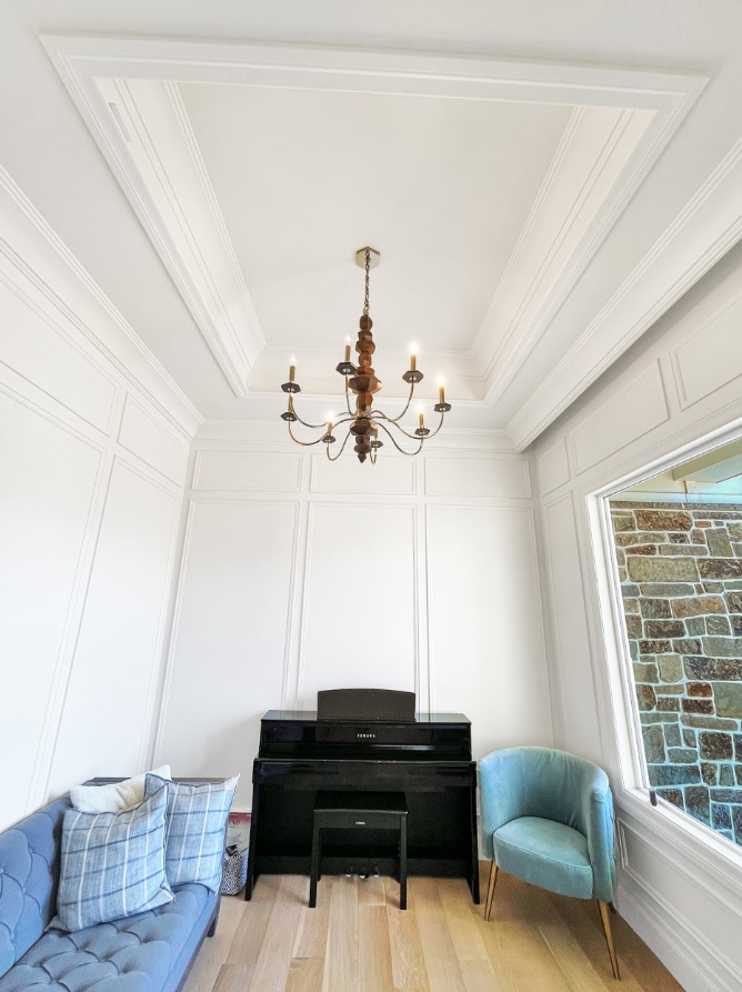 Coffered ceiling and wall paneling detail built by Sharp Blade Trim Works in Utah County