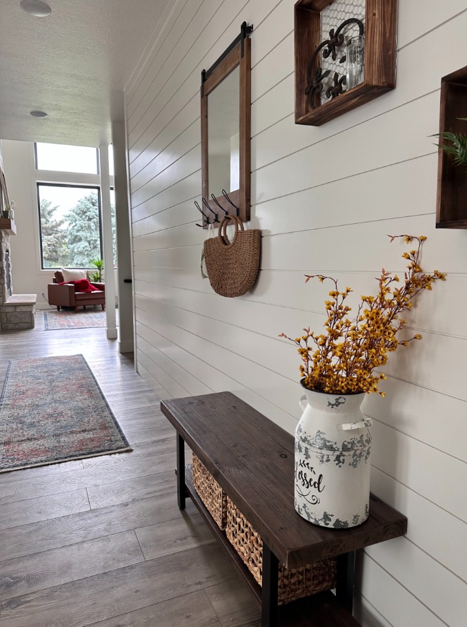 Hallway with custom shiplap wall and bench