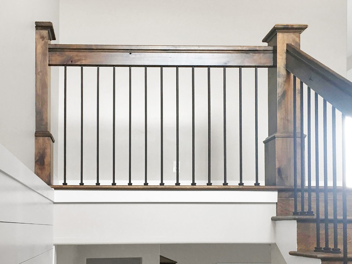 Custom wood and metal staircase railing detail