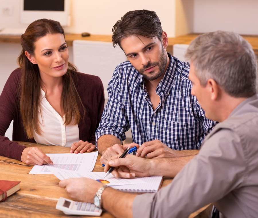Family reviewing immigration bond documents with specialist