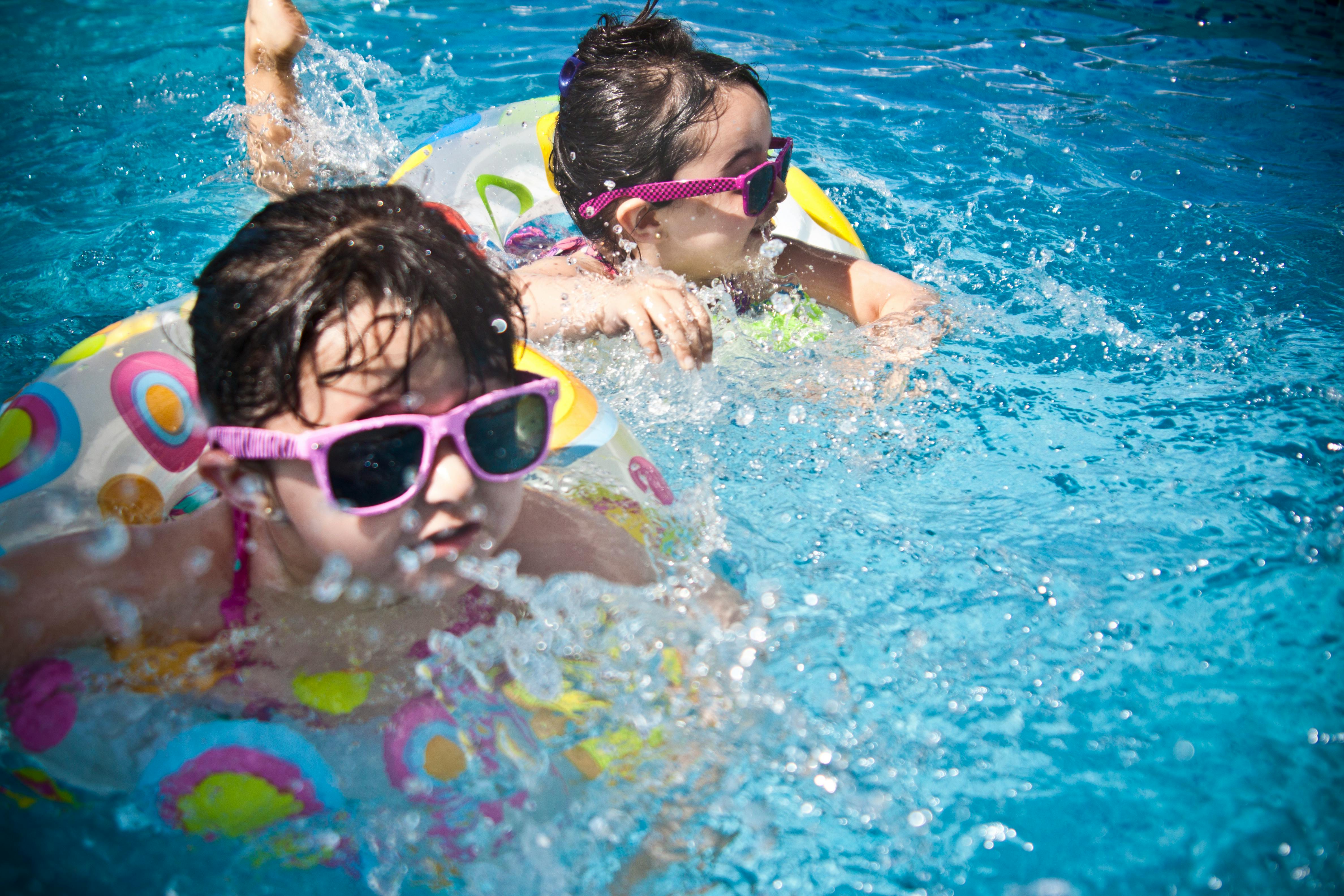 Happy family enjoying pool