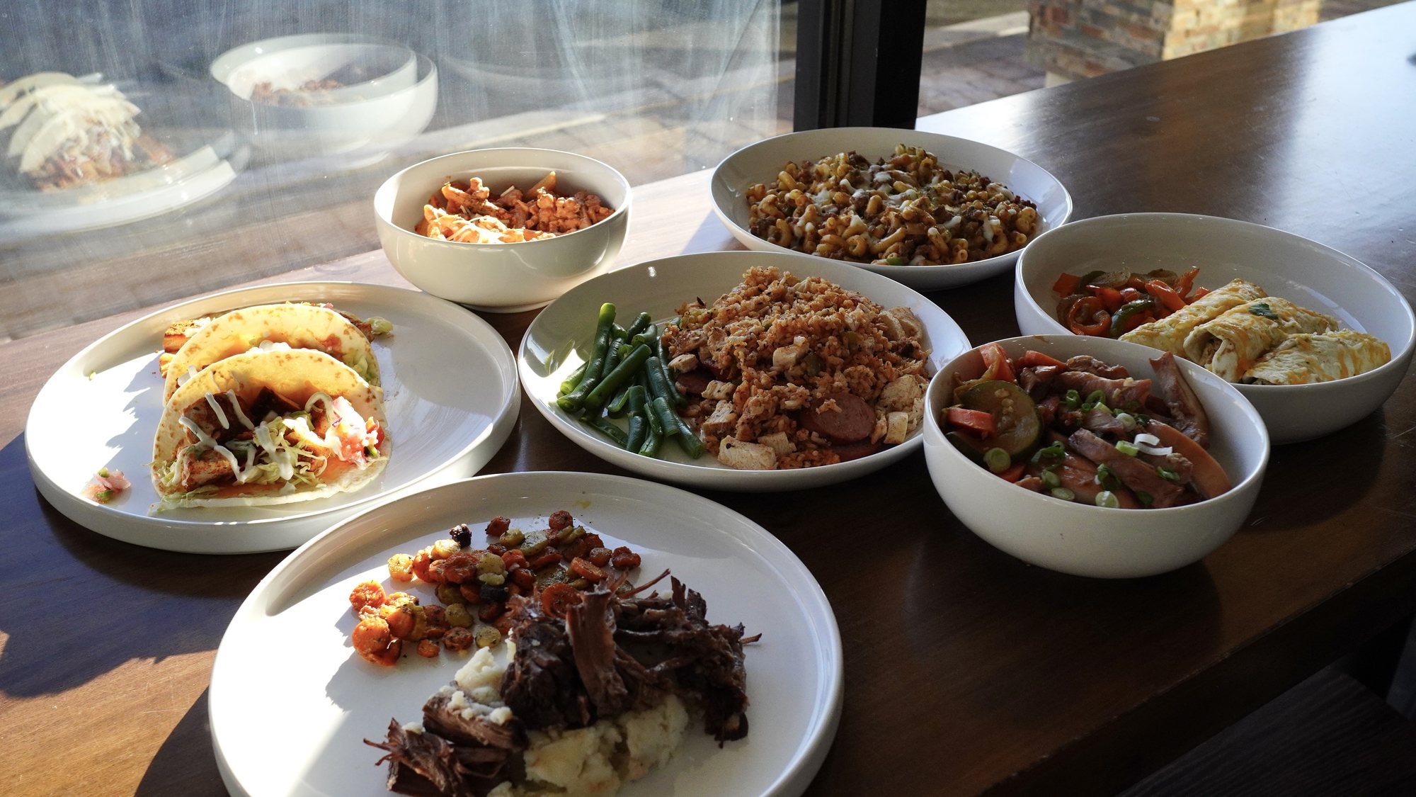 End Goal Meal Prep plated meals with grilled chicken, beef, tacos, rice and veggies