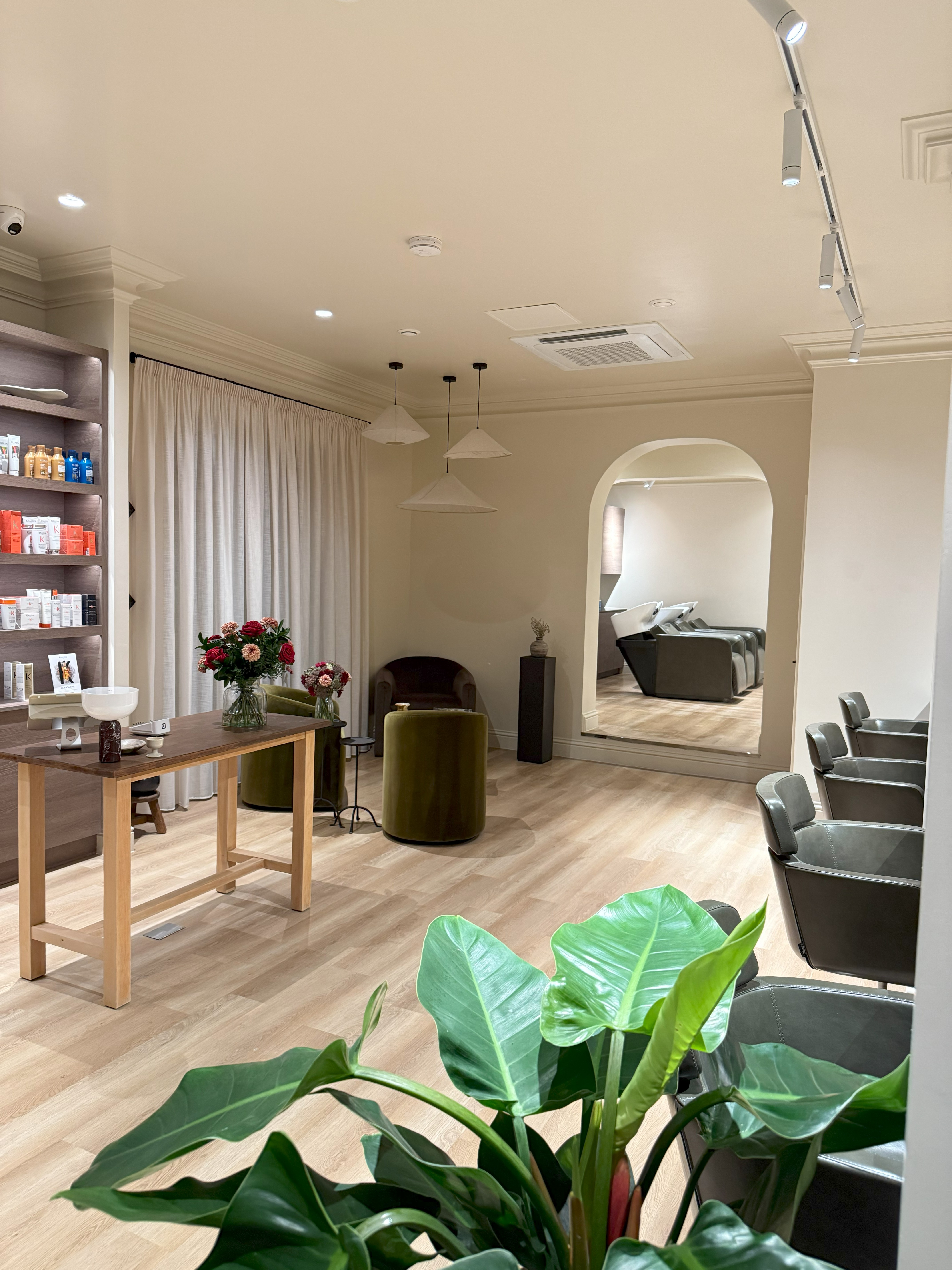 Premium salon interior with styling stations and product displays - professionally cleaned by Crystal Clean