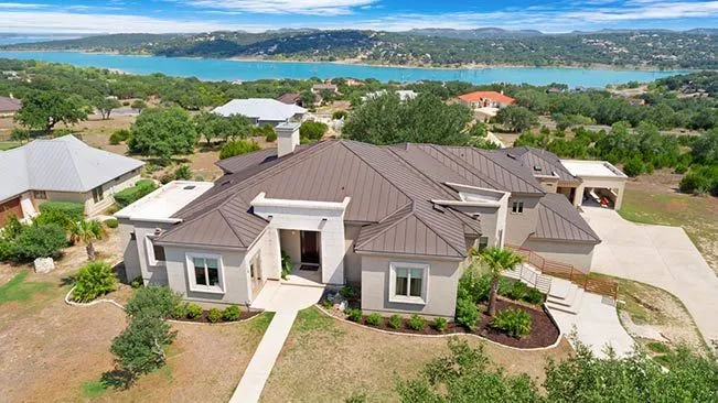 Aerial view of a sprawling Texas Hill Country estate situated near the shores of Canyon Lake