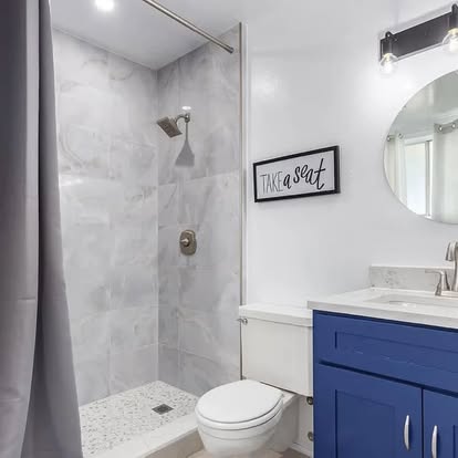 White & Grey Shower with Blue Vanity White & Grey Shower with Blue Vanity - Bathroom Remodeling by Builders For You Construction in Yuma, AZ