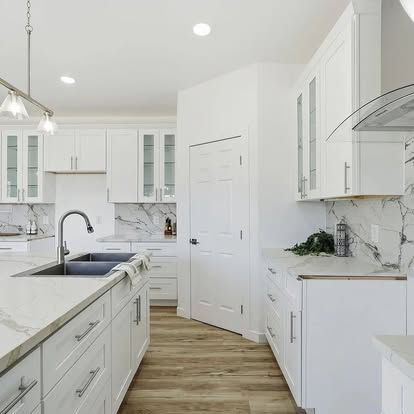 White Kitchen with Glass-Front Cabinets - Kitchen Remodeling by Builders For You Construction in Yuma, AZ