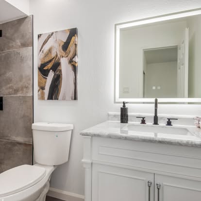 Dark Shower & White Vanity with LED Mirror Dark Shower & White Vanity with LED Mirror - Bathroom Remodeling by Builders For You Construction in Yuma, AZ