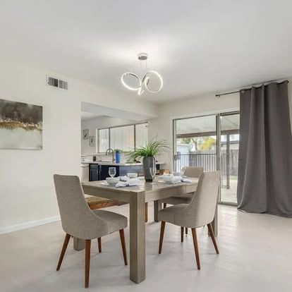 Dining Area with Light Wood Flooring - Flooring Installation by Builders For You Construction in Yuma, AZ