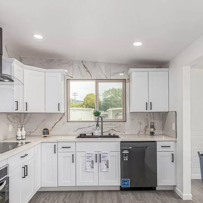 Bright White Kitchen with Marble Backsplash - Kitchen Remodeling by Builders For You Construction in Yuma, AZ