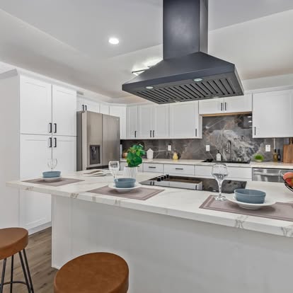 Kitchen Island with Black Range Hood - Kitchen Remodeling by Builders For You Construction in Yuma, AZ