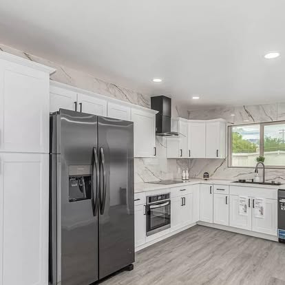 Bright White Kitchen with Stainless Appliances - Kitchen Remodeling by Builders For You Construction in Yuma, AZ
