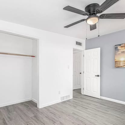Bedroom with Grey Wood-Look Flooring - Flooring Installation by Builders For You Construction in Yuma, AZ