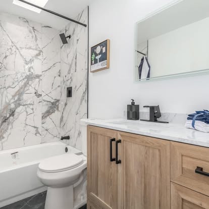 Marble-Look Shower Over Tub with Wood Vanity Marble-Look Shower Over Tub with Wood Vanity - Bathroom Remodeling by Builders For You Construction in Yuma, AZ