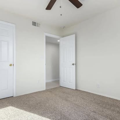 Cozy Bedroom with Plush Carpet - Flooring Installation by Builders For You Construction in Yuma, AZ