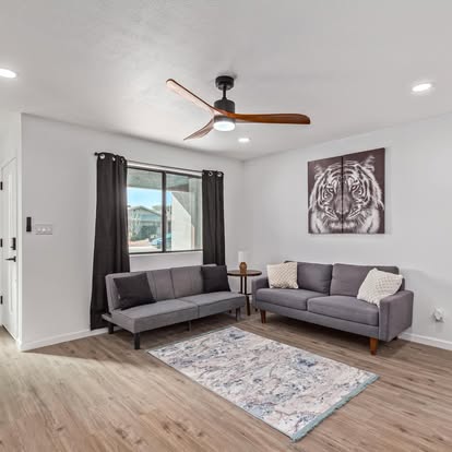 Living Room with Warm Wood Flooring - Flooring Installation by Builders For You Construction in Yuma, AZ