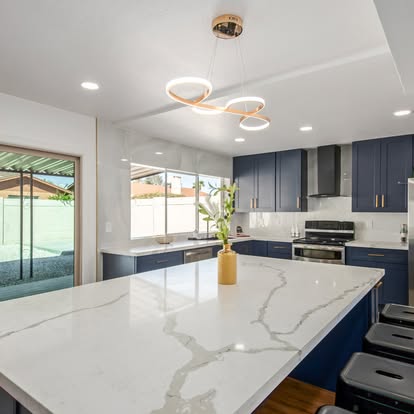 Navy Blue Kitchen with Quartz Island - Kitchen Remodeling by Builders For You Construction in Yuma, AZ