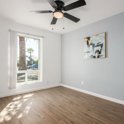 Modern Bedroom with Wood-Look Flooring - Flooring Installation by Builders For You Construction in Yuma, AZ