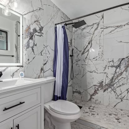 White Marble-Look Shower with Black Fixtures White Marble-Look Shower with Black Fixtures - Bathroom Remodeling by Builders For You Construction in Yuma, AZ