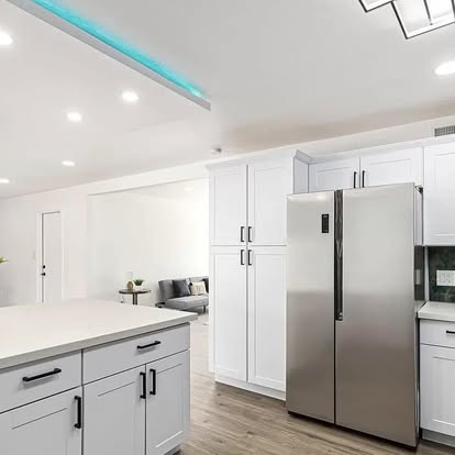 White Kitchen with Stainless Refrigerator - Kitchen Remodeling by Builders For You Construction in Yuma, AZ