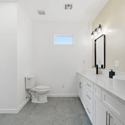 Bathroom with Gray Tile Flooring - Flooring Installation by Builders For You Construction in Yuma, AZ