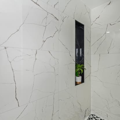 Marble-Look Tile Shower with Black Niche Marble-Look Tile Shower with Black Niche - Bathroom Remodeling by Builders For You Construction in Yuma, AZ