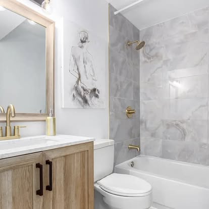 Gray Shower with Gold Fixtures Gray Shower with Gold Fixtures - Bathroom Remodeling by Builders For You Construction in Yuma, AZ