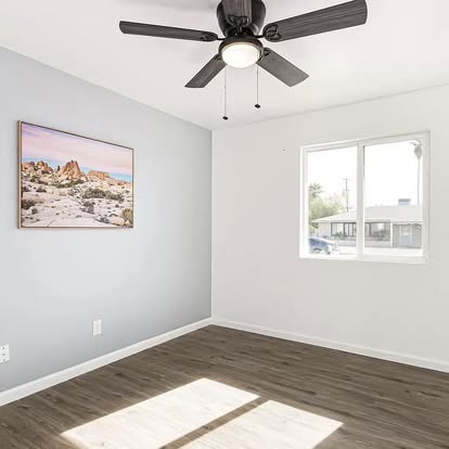 Room with Dark Wood-Look Flooring - Flooring Installation by Builders For You Construction in Yuma, AZ