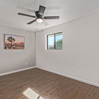 Bedroom with Wood-Look Flooring - Flooring Installation by Builders For You Construction in Yuma, AZ