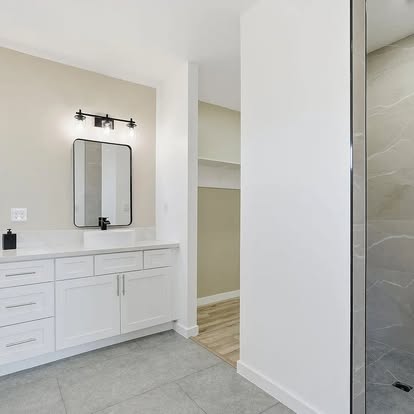 Bright White Vanity with Marble Shower Bright White Vanity with Marble Shower - Bathroom Remodeling by Builders For You Construction in Yuma, AZ