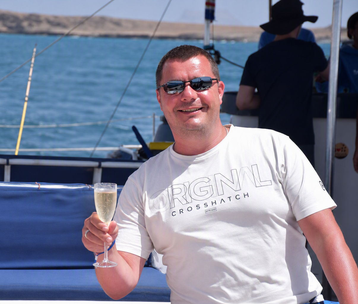 Leon on a boat with champagne
