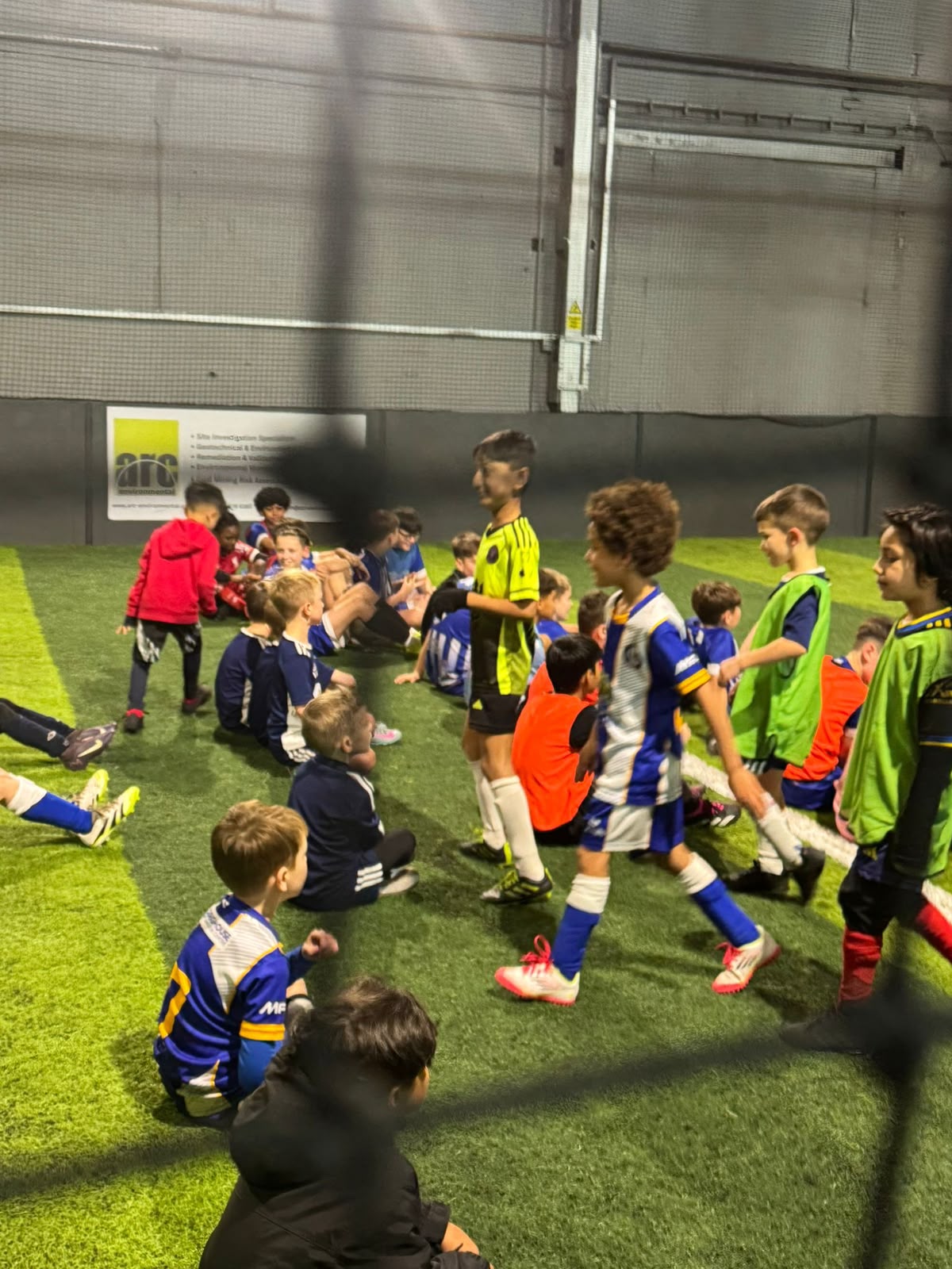 Toddlers and younger children enjoying football coaching