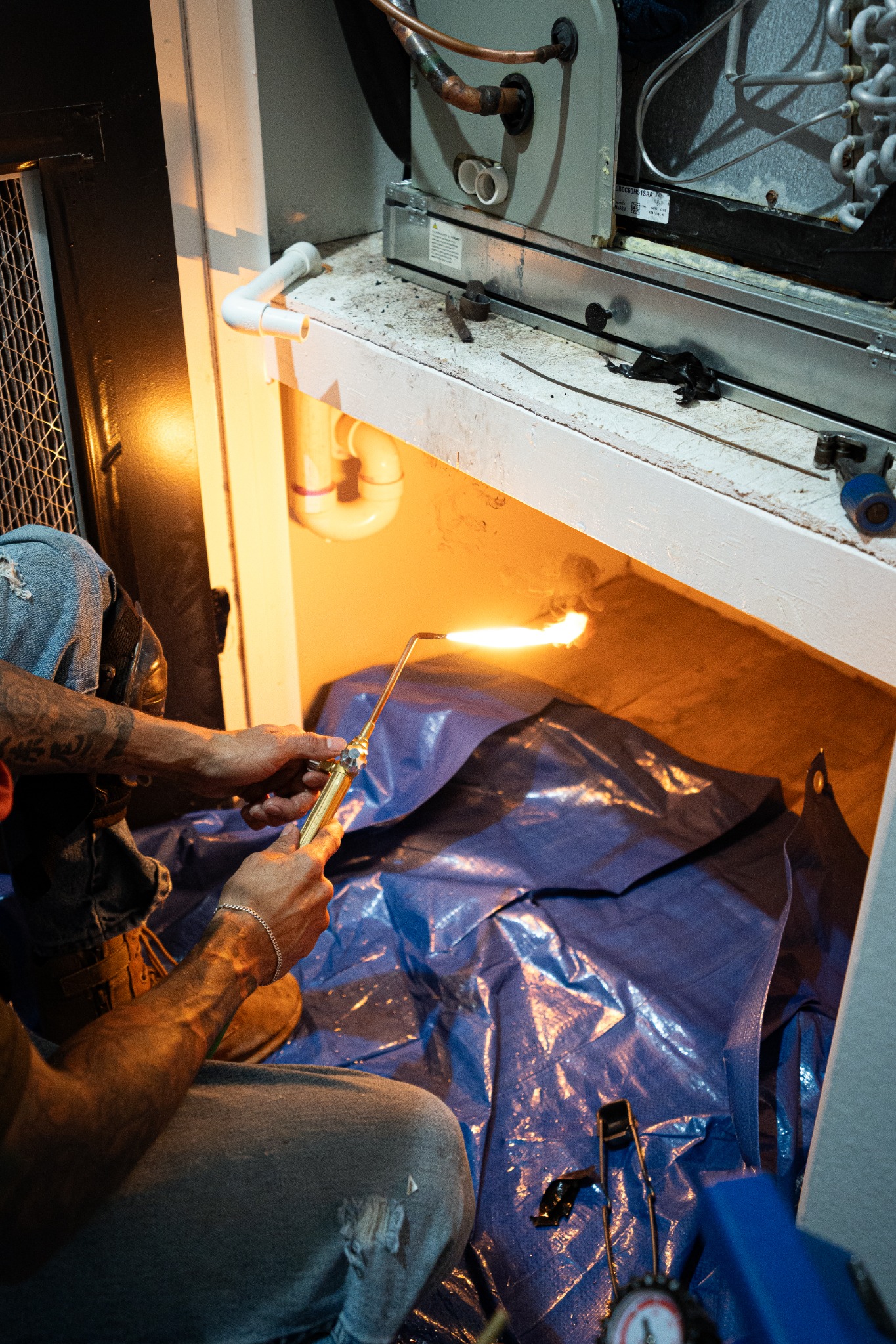 Technician Lighting Oxy-Acetylene Torch for Copper Brazing — McAllen, TX