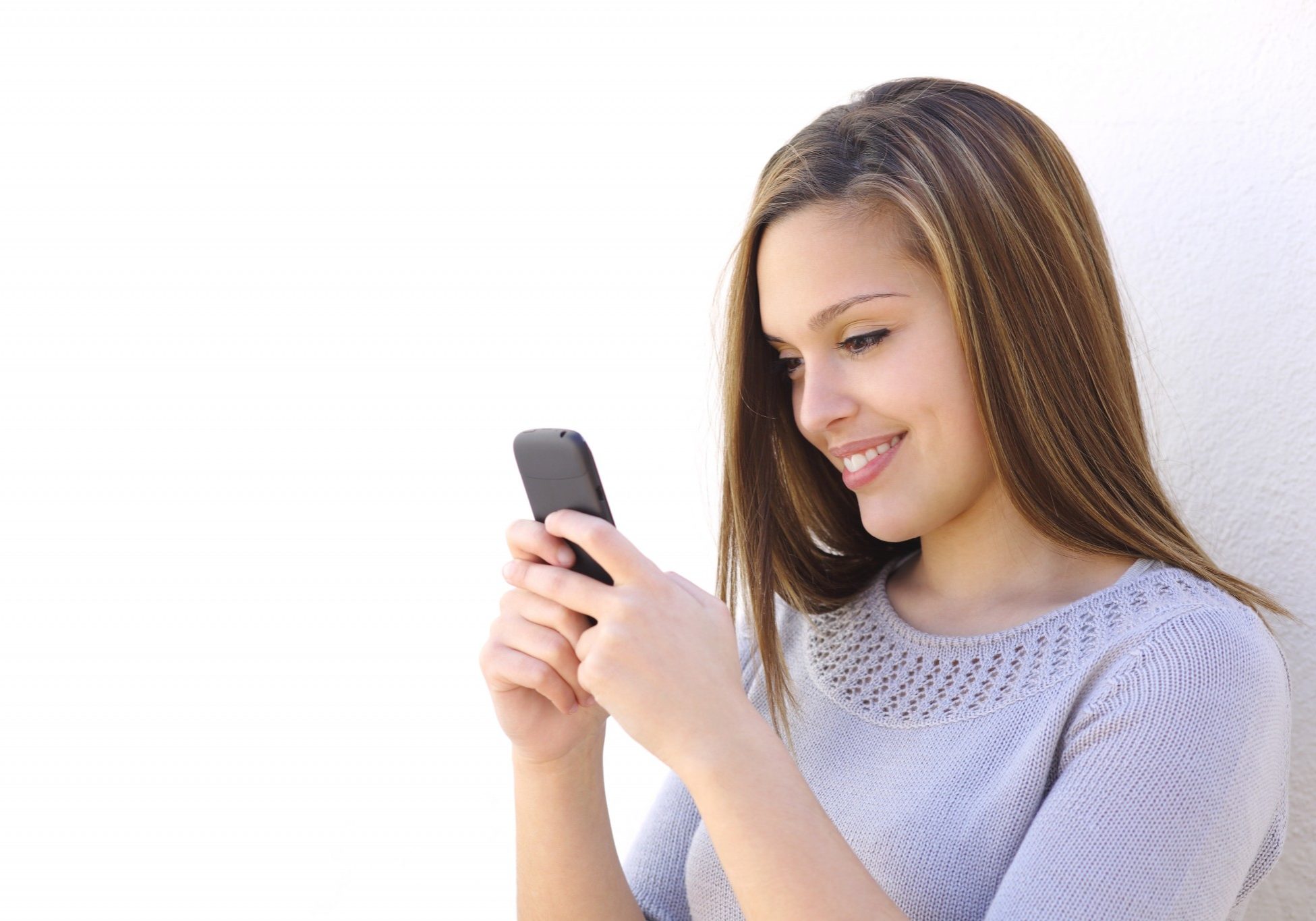 Woman texting on smartphone