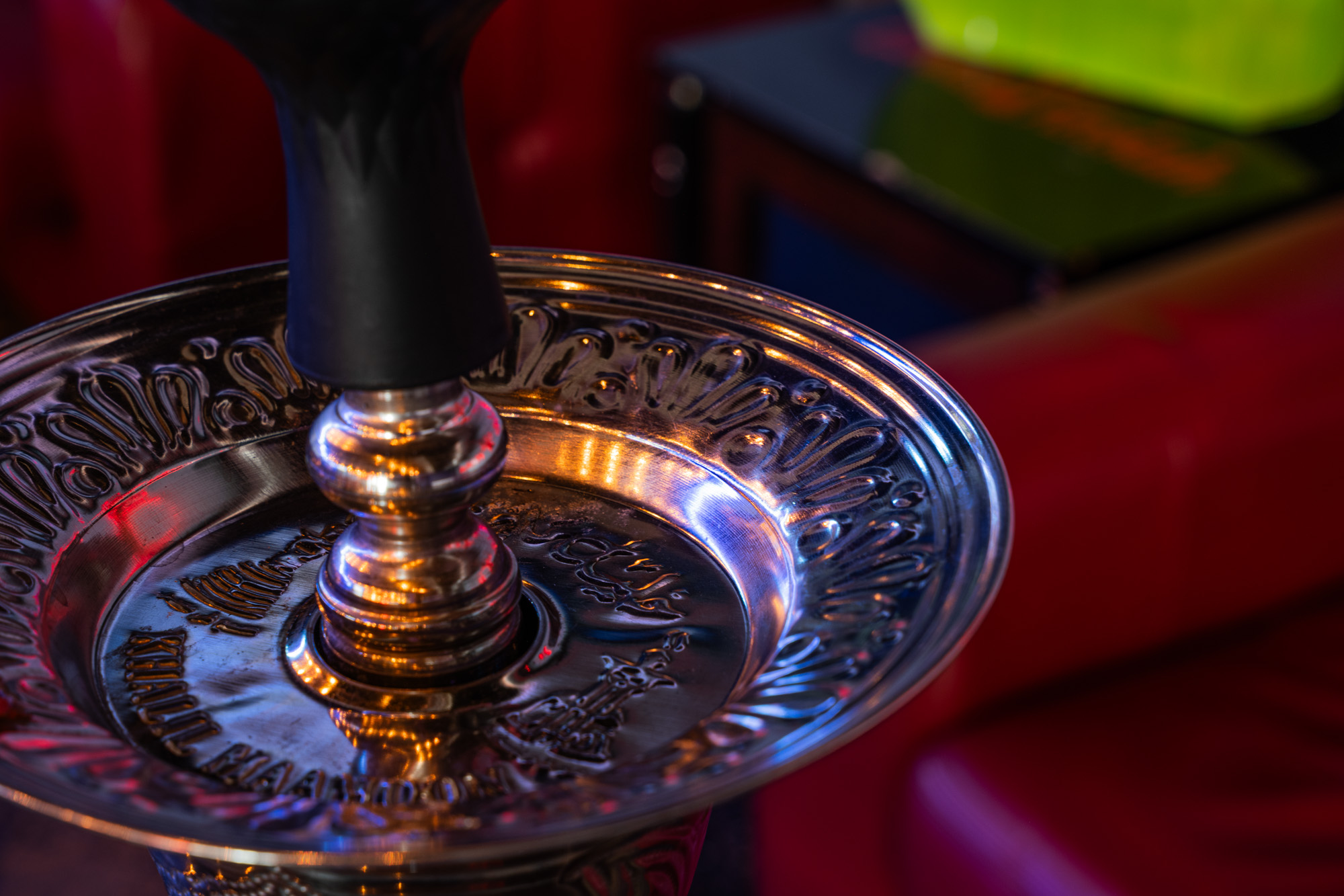 Comfortable lounge seating and warm amber lighting at Exhale Hookah Lounge