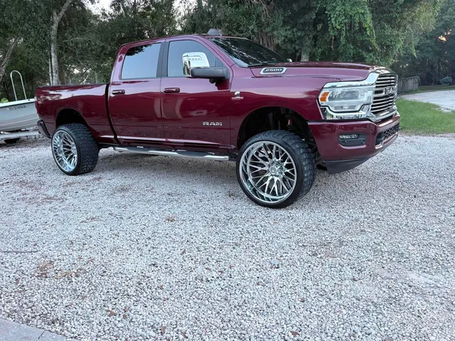 Detailed maroon Ram 2500 truck with custom wheels
