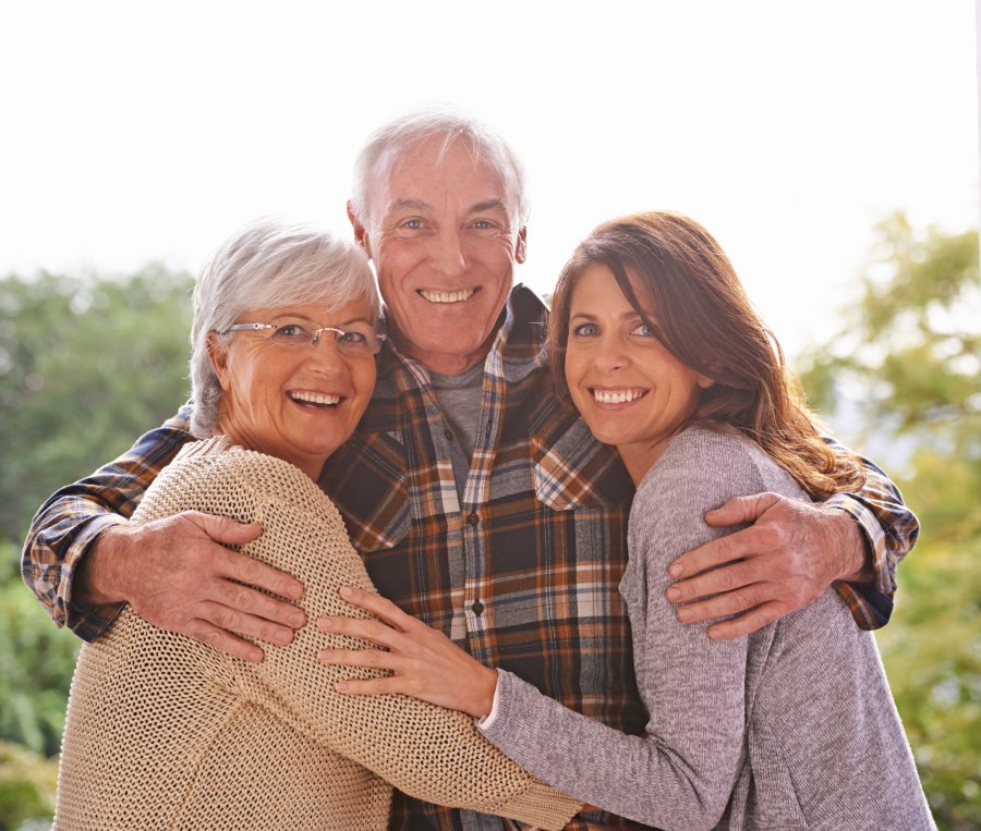 Family hugging and smiling together