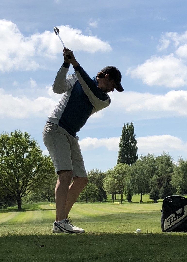 Chris Weston mid golf swing on the tee