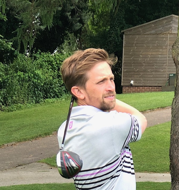Chris Weston finishing a golf swing outdoors