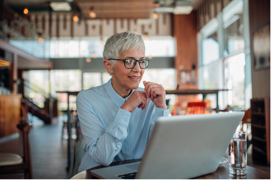 Person reflecting at laptop