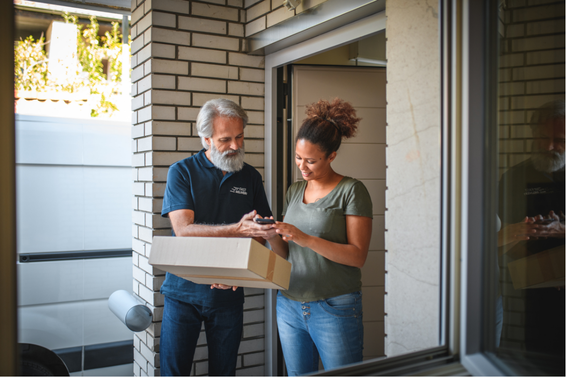 Delivery person handing package